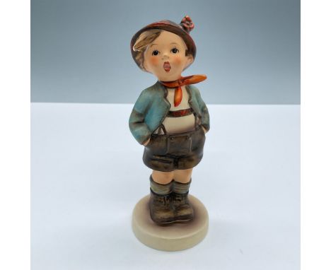 Adorable child dressed in traditional clothes with his hands on his pockets. Goebel Hummel backstamp. Artist: M. I. HummelIss