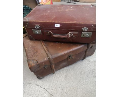 Vintage travel trunk with wooden bounding together with leather travel case. 