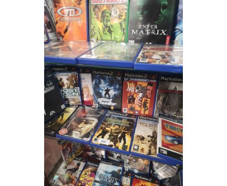 Shelf of PlayStation 2 games.    