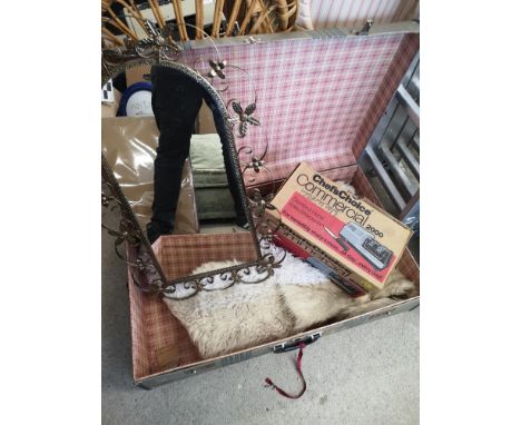 Vintage trunk containing rugs and mirror. 