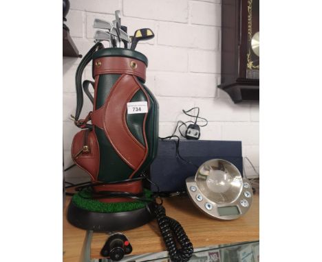Golfer s telephone together with alarm clock. 