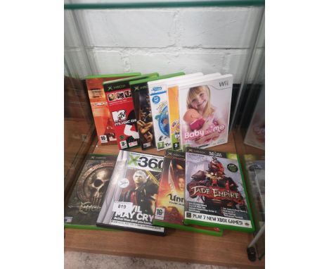 Shelf of xbox and wii games. 