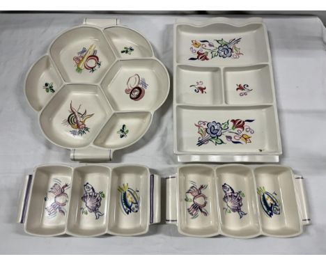 A collection of four Poole pottery hors d'oeuvres dishes. Largest W.33cm. 