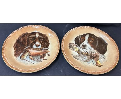 Pair Clarice Cliff  wall plates, depicting a hunting dog and catch, diameter of plates 11 inches