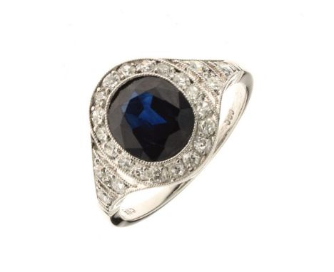Sapphire and diamond ring, with various marks, the oval cut sapphire approximately 7.8mm x 6.6mm x 3.8mm deep, enclosed by si