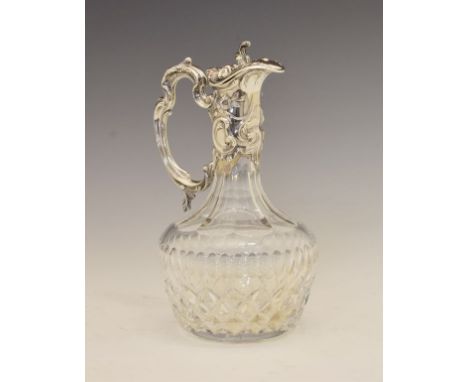 20th Century cut crystal claret jug, with Continental silver mount and finial, decorated with Classical embossed decoration, 