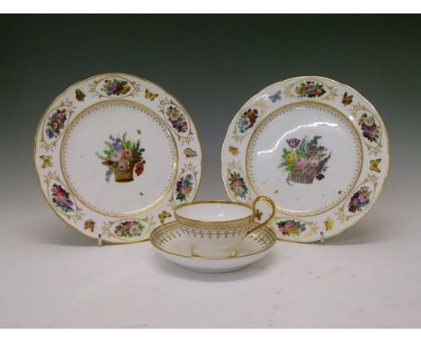 Pair of early 19th Century Sevres porcelain plates, the later-decorated surface with a central basket of summer flowers, the 