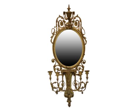 19th Century giltwood and gesso girandole wall mirror, the plain oval plate beneath urn surmount with swags and foliate scrol