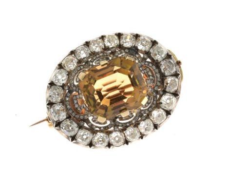 Late Victorian citrine and diamond oval brooch, the step cut quartz approximately 15.6mm x 13.5mm x 10.5mm deep, enclosed by 