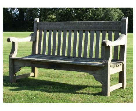 Mid 20th Century weathered teak garden bench, the back rail carved with verses from 'God's Garden' by Dorothy Frances Gurney 