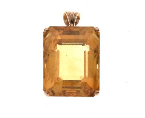 Large single stone citrine pendant, in an unmarked gold coloured four claw mount, the step cut stone measuring approximately 