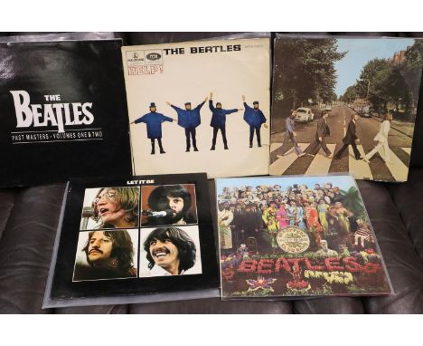 Five Beatles LP's including SGT. Peppers.  P&amp;P Group 2 (£18+VAT for the first lot and £3+VAT for subsequent lots) 