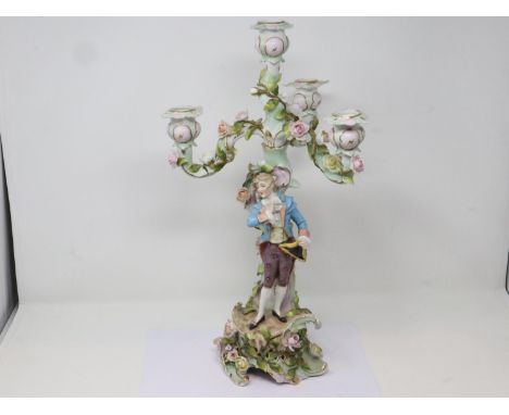 19th century Dresden figural candelabra of three branches with applied floral decoration, several repairs throughout and loss