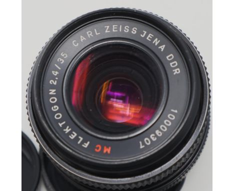 Zeiss Flektogon f = 2.4m 35mm lens with lens caps. P&amp;P Group 1 (£14+VAT for the first lot and £1+VAT for subsequent lots)