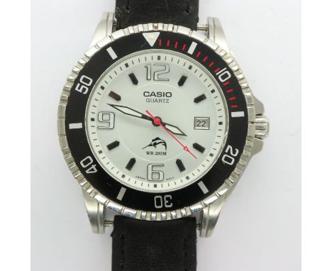 CASIO: quartz 200m divers wristwatch with date aperture on a leather strap, working at lotting. P&amp;P Group 1 (£14+VAT for 