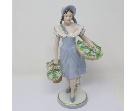 Royal Dux girl with flower baskets figurine, some losses to flowers, H: 27 cm. P&amp;P Group 2 (£18+VAT for the first lot and