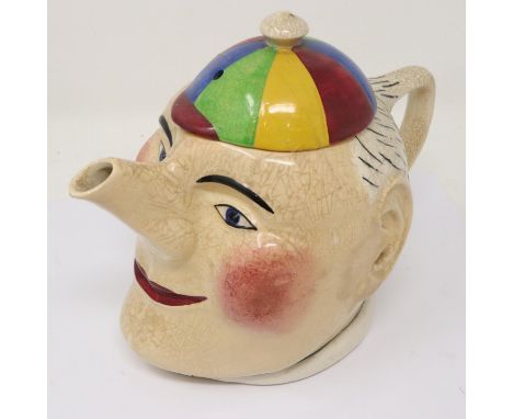 Early 20th century Devonmoor teapot, Simple Simon, from a design by Joe Vernon, discoloured crazing throughout, H: 15 cm. P&a