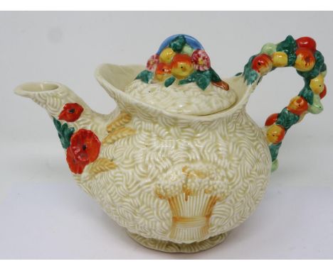 Clarice Cliff for Newport Pottery teapot in the Harvest pattern, repair to interior rim otherwise no cracks or chips, L: 24 c