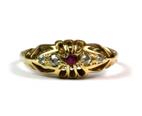 An 18ct yellow gold ruby and diamond set ring (Q).