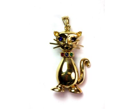 A 9ct yellow gold cat shaped pendant set with ruby, sapphire and other stones.