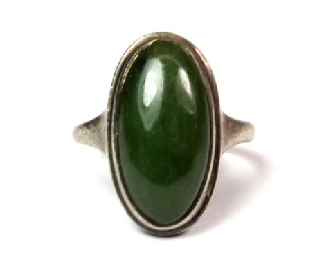 An antique sterling silver (with a worn hallmark) jade set ring (L).