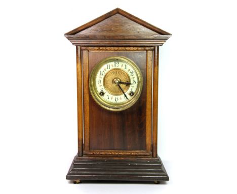 A Victorian oak and mahogany mantle clock, H. 39cm.