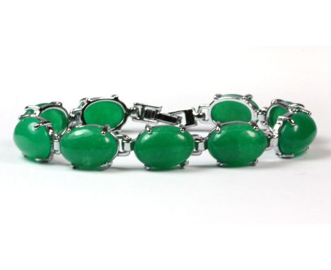 A white metal mounted jade bracelet.