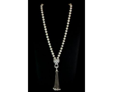 A stunning dragon shaped cultured pearl necklace set with cubic zirconia.