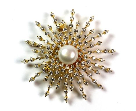 A 925 silver gilt brooch set with a cultured pearl and cubic zirconias.