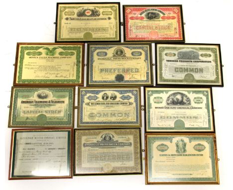 A collection of framed antique share certificates.