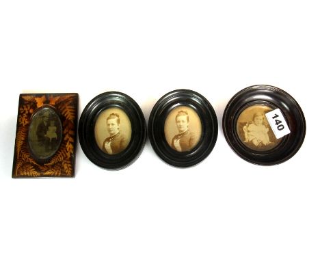 Five photograph portrait miniatures.