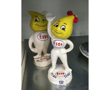 A pair of painted cast iron Esso advertising figures.