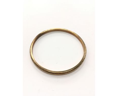 A large hand engraved 9 carat gold bangle (total weight 8 grams).