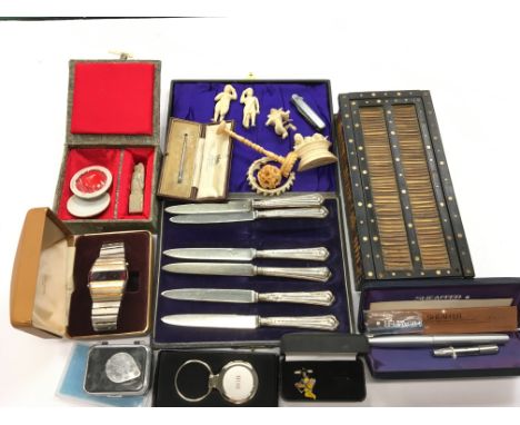 A box of mixed collectables to include a Porcupine quill box and a cased set of six silver handled fruit knives, Sheffield 19