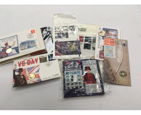 A collection of various First Day Cover presentation coins including £5 and £2 together with other uncirculated coins and a S