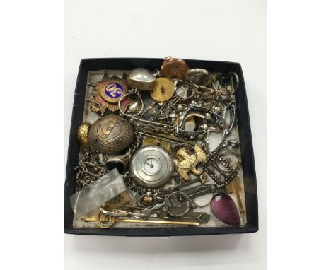 A box containing silver and white metal jewellery to include a ladies silver cased fob watch, silver gilt enamel badge and ot