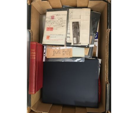 A box containing a very large quantity of mixed stamps to include stamp accessories, albums to include First Day Covers and a