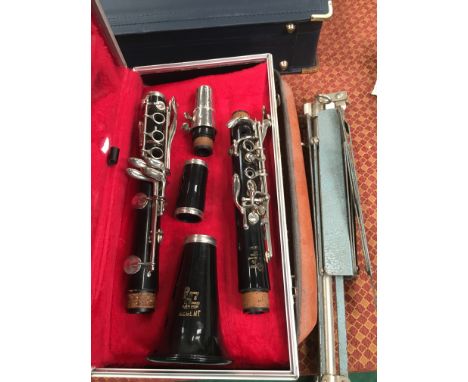 A Boosey and Hawks, London Regent clarinet in case together with a music case and metal stand.