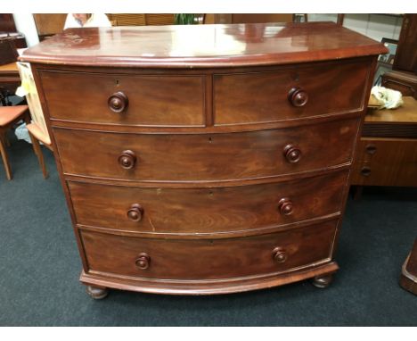 A Victorian mahogany bow front chest of two short and three long graduated drawers, resting on bracket feet.