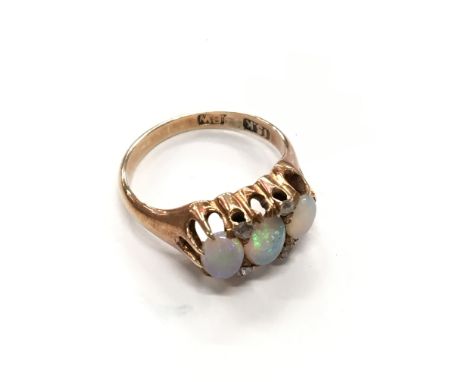 A 15 carat gold opal and diamond ring (af).