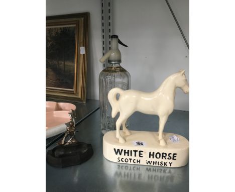 A White Horse Scotch Whisky plaster advertising bar sign together with a glass soda syphon and a Bakelite Selcol Vogue ashtra