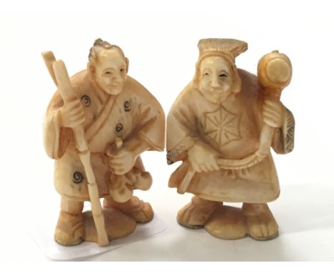 Two late 19th/early 20th century carved ivory Netsuke modelled as Male Labourers (signed to base).