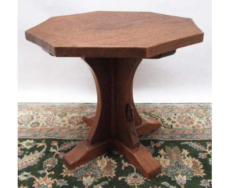 Robert Mouseman Thompson of Kilburn - an oak octagonal coffee table, adzed top on cruciform column support, D55cm H47cm 