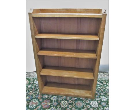 Robert Mouseman Thompson of Kilburn - an oak bookcase, galleried adzed top and and sides with three adjustable shelves, carve