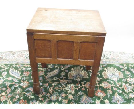 Robert Mouseman Thompson of Kilburn - an panelled oak sewing box, adzed hinged top with lift out fitted tray, on adzed octago