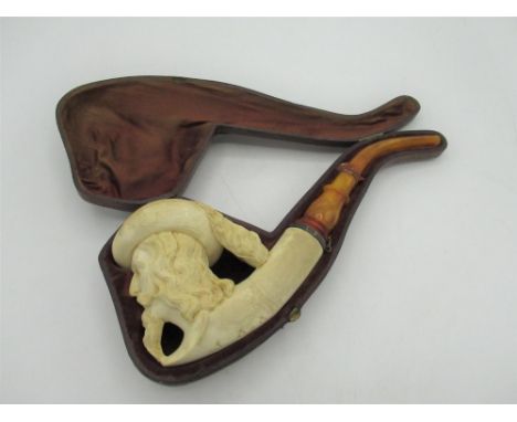C19th Meerschaum pipe, bowl carved as the head of a bearded gentleman with plumed hat, L26cm in fitted leather case 