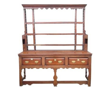 C18th and later oak dresser, raised three shelf back with moulded cornice shaped frieze and spice drawers, the base with thre