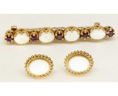 Hallmarked 9ct yellow gold opal and ruby bar brooch, four oval, claw set cabochon opals separated by five round cut, claw set