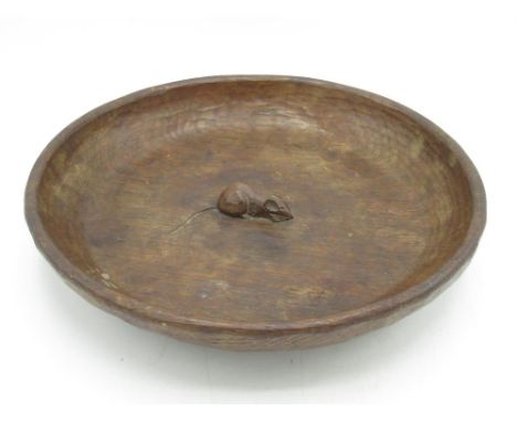 Robert Mouseman Thompson of Kilburn - a circular adzed oak fruit bowl, central relief carved signature mouse,  D29cm 