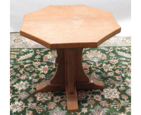 Robert Mouseman Thompson of Kilburn - an oak octagonal coffee table, adzed top on cruciform column support, D55cm H47cm 